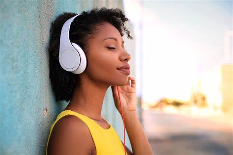 A photograph of someone listening to music and enjoying it